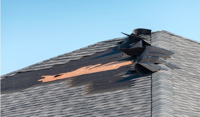 Storm-damaged roof shingles after severe Colorado weather