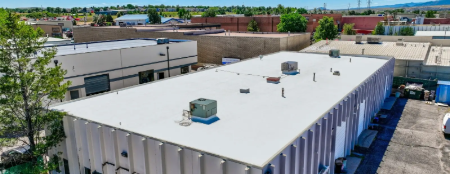 Commercial building with low-slope roofing system