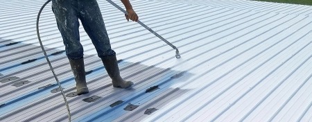 Commercial roof system being applied to a flat business roof