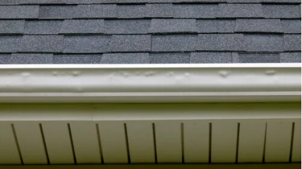 Hail damage visible on a home's gutter system