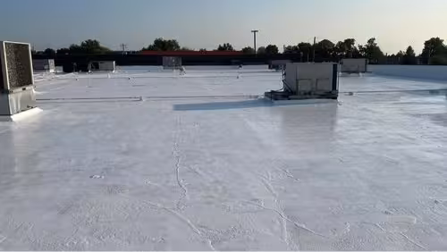 Acrylic reflective coating system on commercial roofing